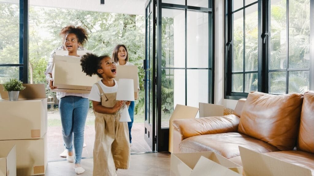 Family moving into new home with boxes.