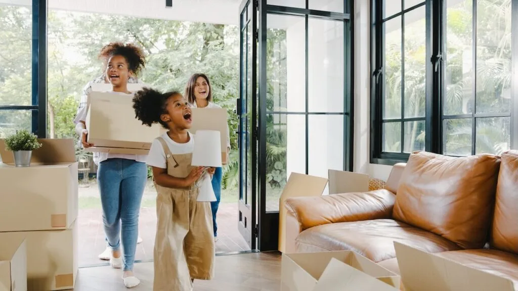 Family moving into new home with boxes.